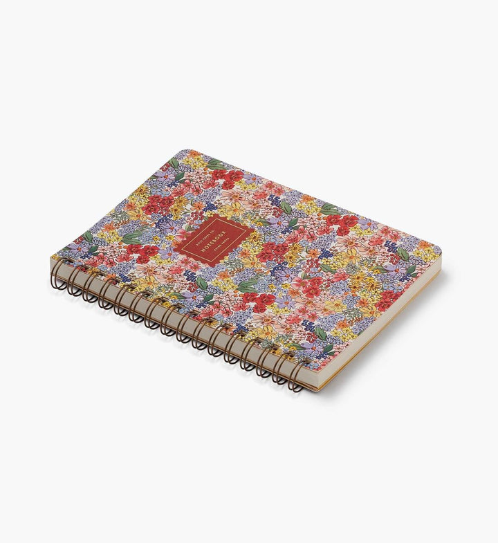 Floral notebook with a red label on a white background