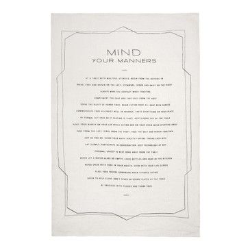 Textile with 'Mind Your Manners' print on a white background