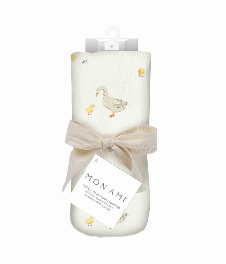 Baby blanket with duck design and 'Mon Ami' label on a white background