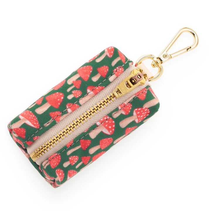 Small pouch with strawberry pattern and gold zipper on a white background