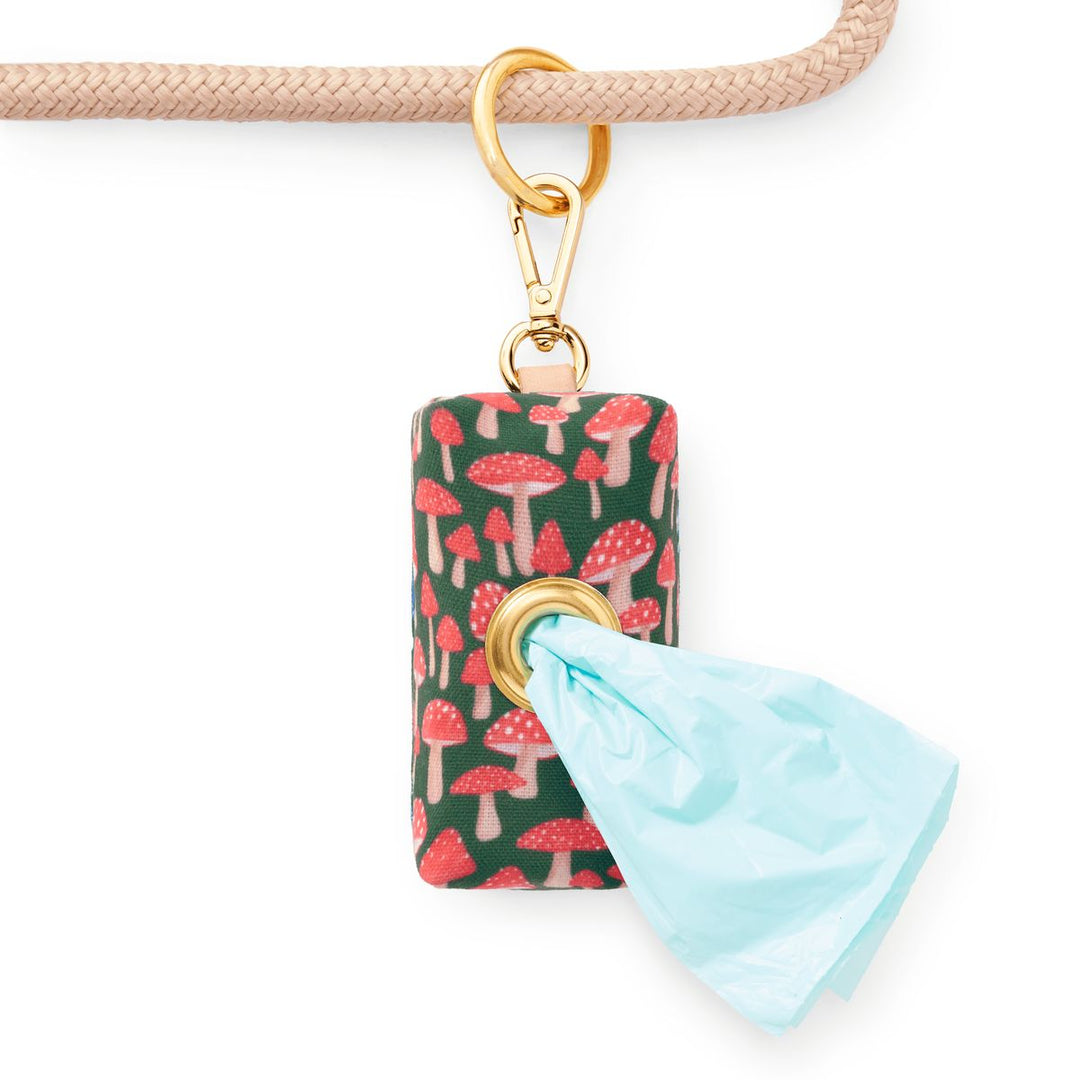 Keychain with mushroom pattern and blue tag on a white background