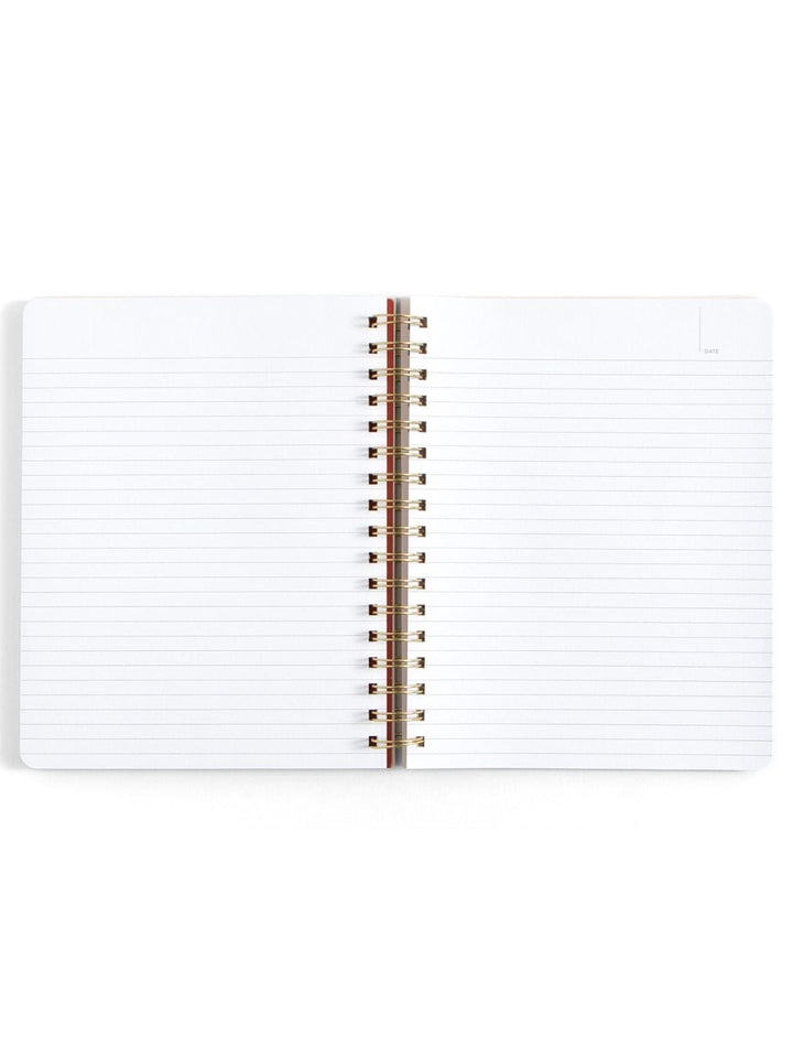 An open spiral-bound lined notebook with white pages and a metallic gold wire binding, photographed on a clean white background.
