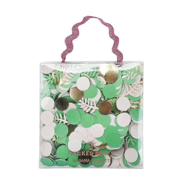 Clear bag filled with green, white, and gold confetti with a pink handle.