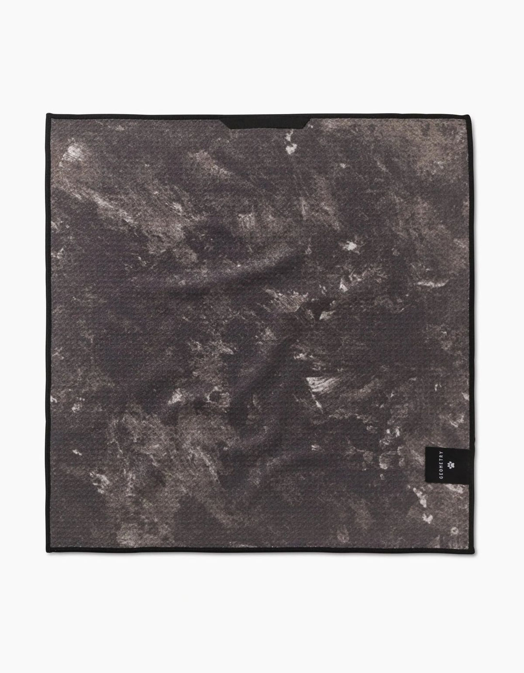 Marble-patterned towel with a brand label on a white background