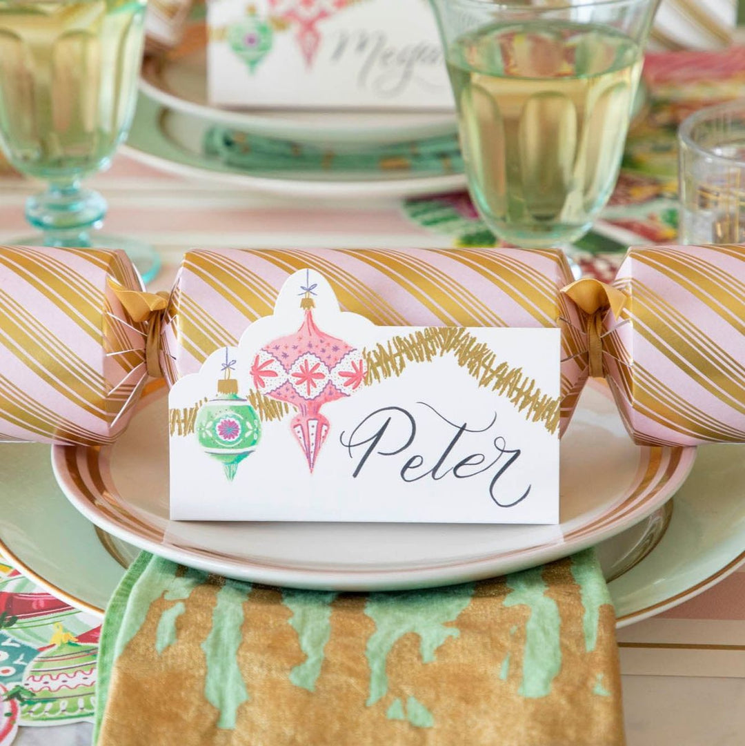 Decorative cracker with a name card on a festive table setting