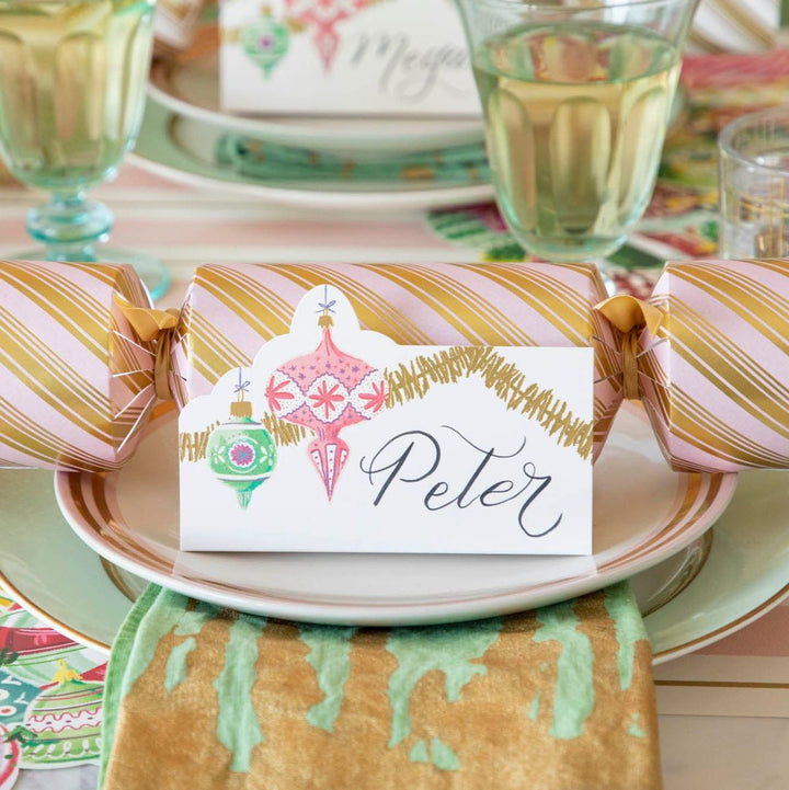 Decorative cracker with a name card on a festive table setting