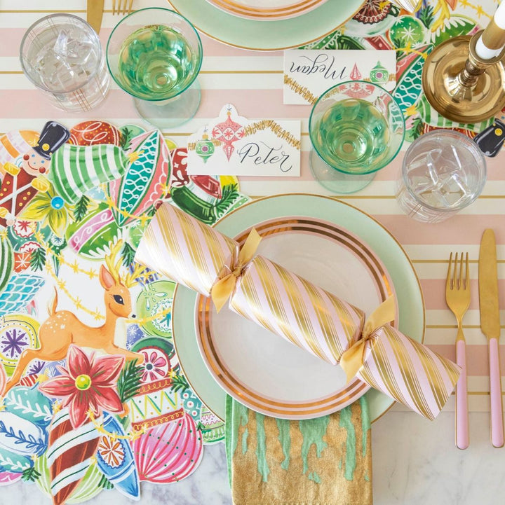 Colorful table setting with place cards and decorative placemats.