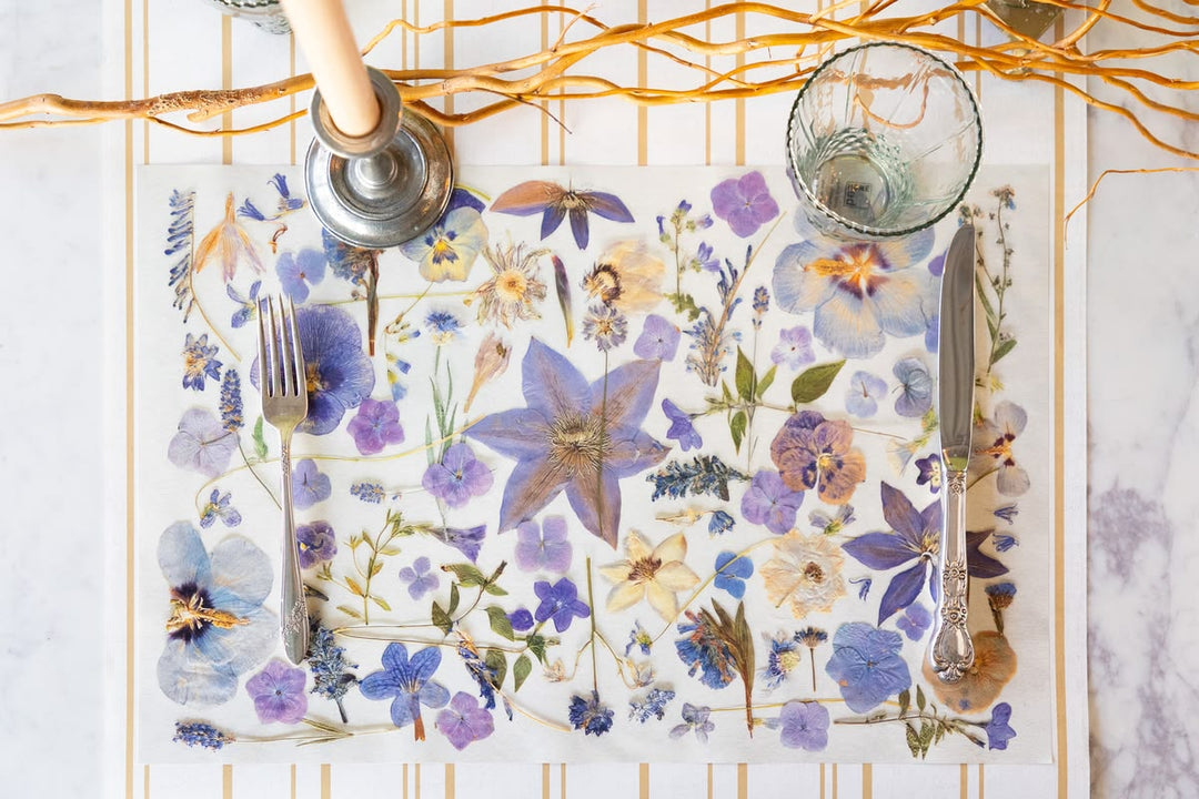 Floral placemat with cutlery on a decorative stand