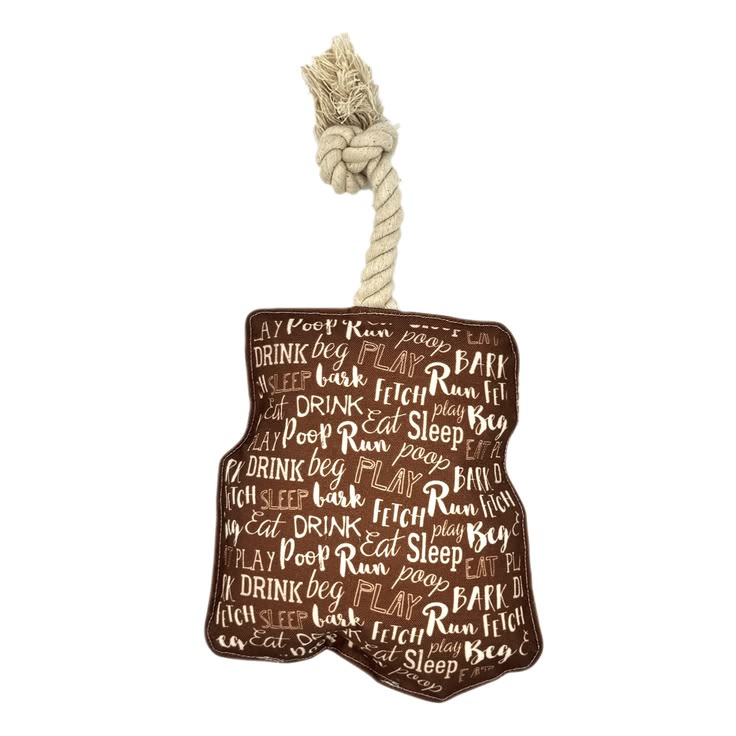 Dog toy resembling a brown leather glove with text and a rope handle on a white background