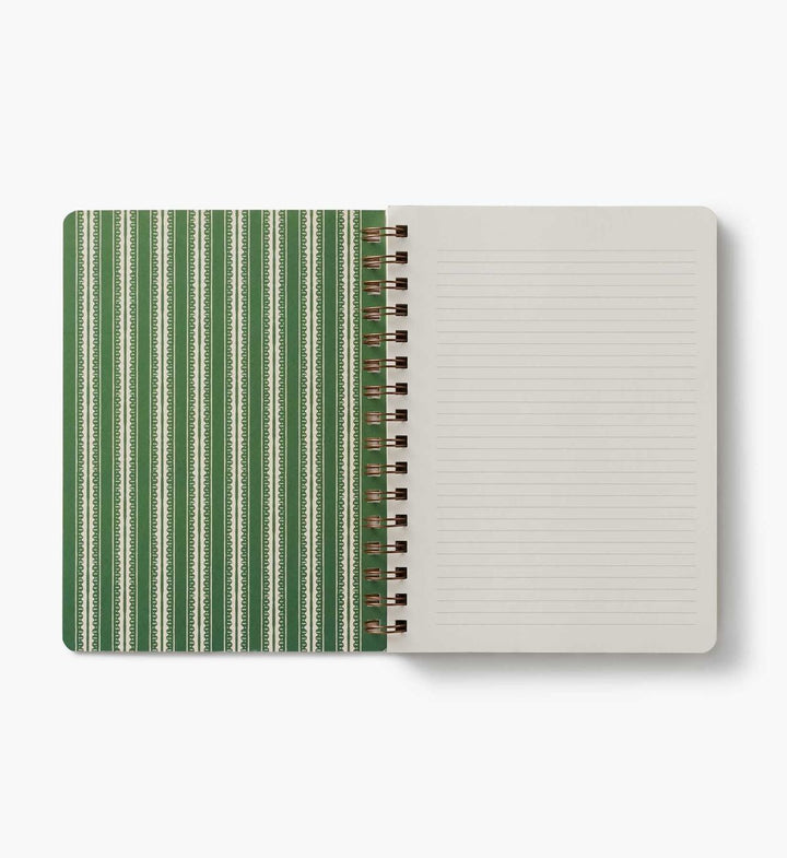 Notebook with green striped cover and beige interior on a white background
