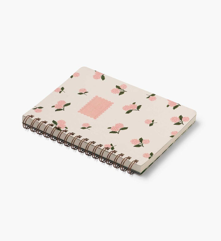 Notebook with floral pattern on a white background