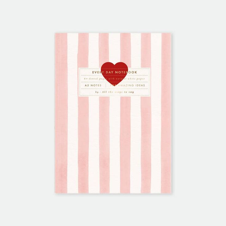 Notebook with pink and white vertical stripes and a red heart design on a white background