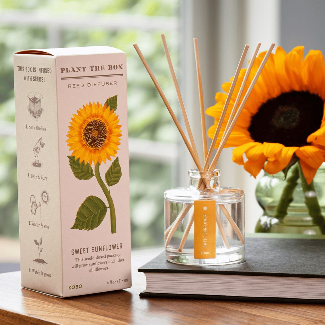 KOKORO Plant the Box Reed Diffuser with sunflower packaging on a wooden surface.