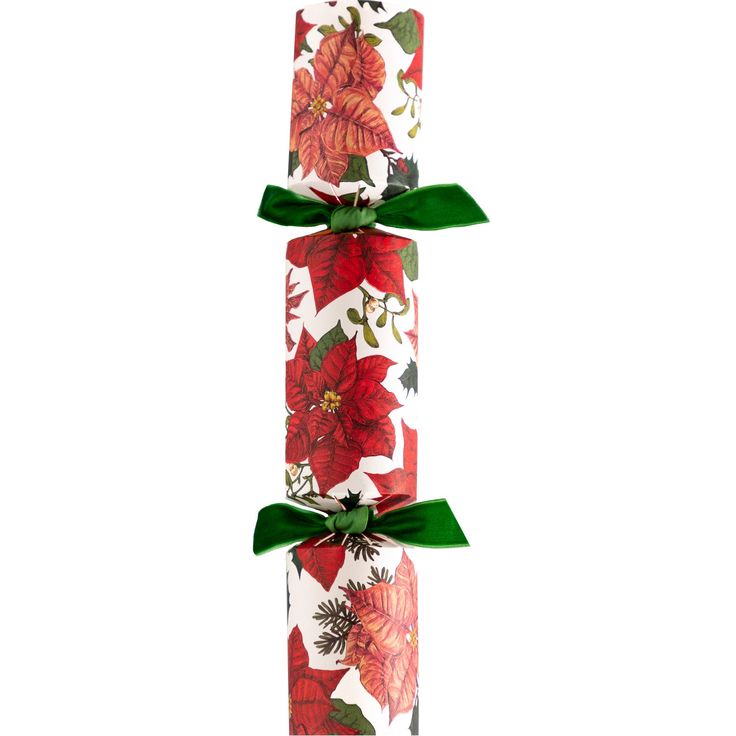 Decorative roll of paper with poinsettia design and green ribbon on a white background