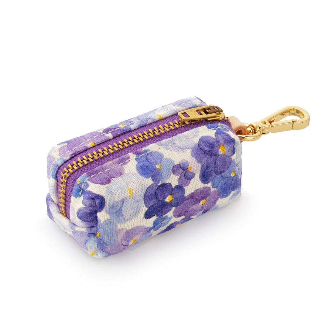 Floral-patterned pouch with a gold zipper on a white background