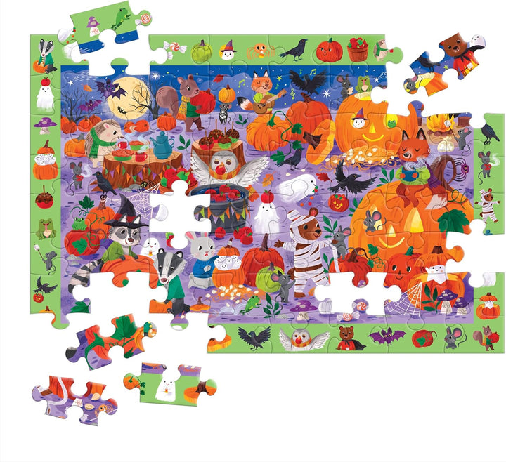 A colorful Halloween-themed jigsaw puzzle with many loose pieces arranged around it on a white background. The puzzle features illustrated pumpkins, bats, ghosts, witches, cats, dogs, and other seasonal characters in bright autumn and spooky colors.