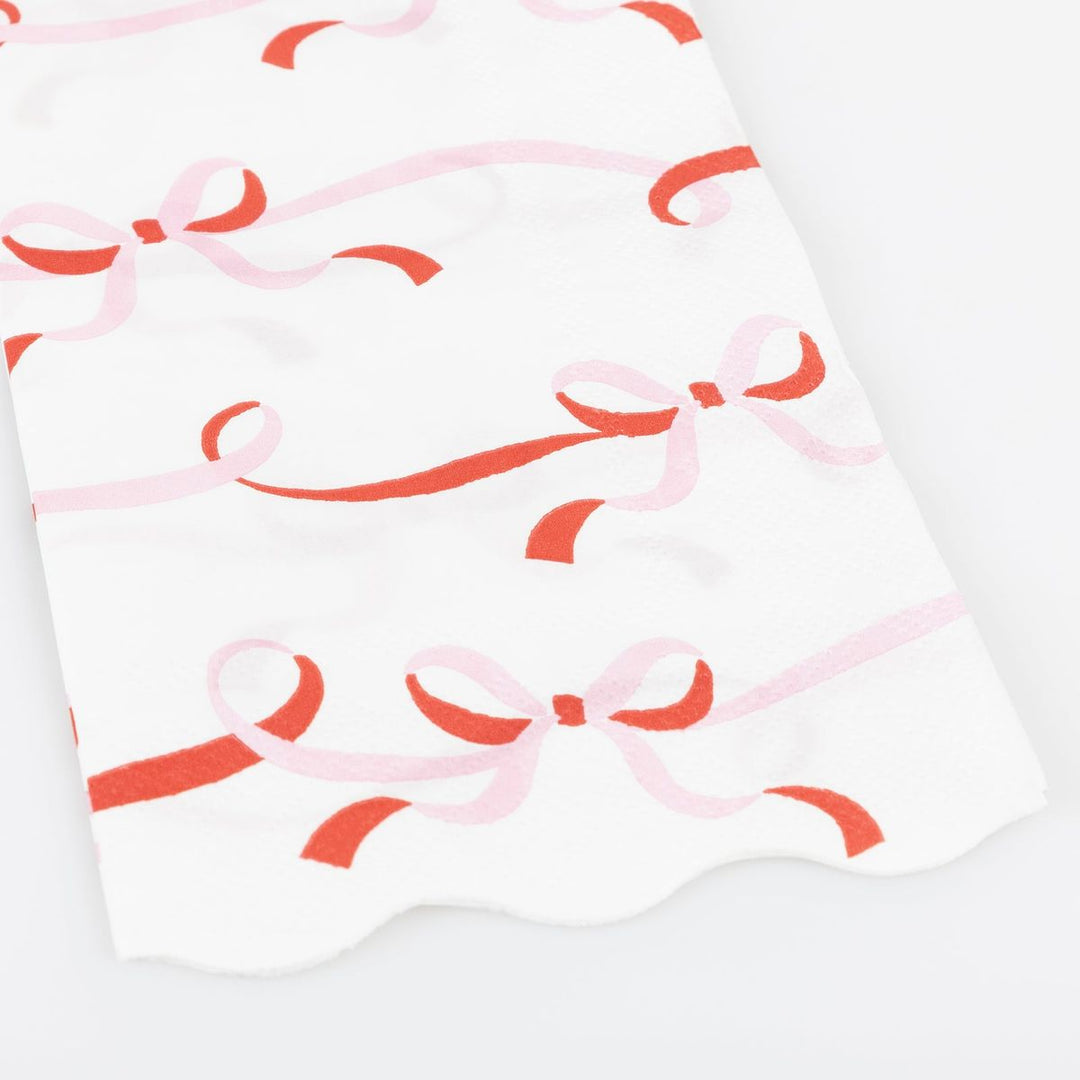 White fabric with red and pink bow pattern