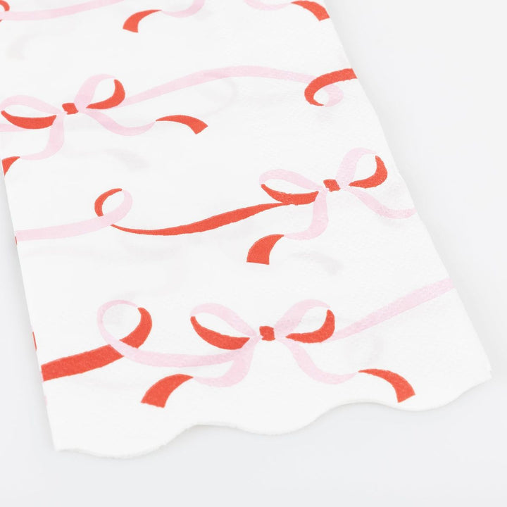 White fabric with red and pink bow pattern
