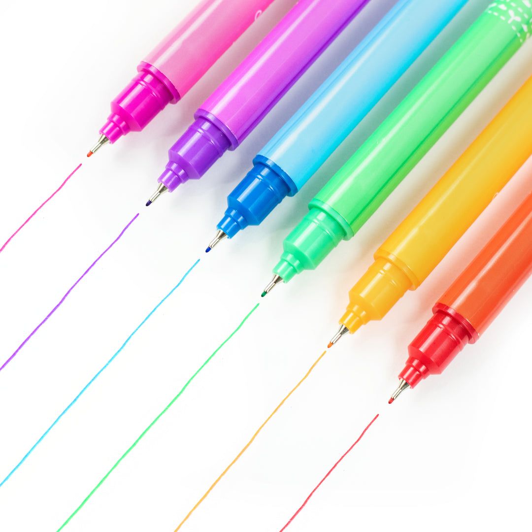 Set of colorful markers with visible ink lines on a white background