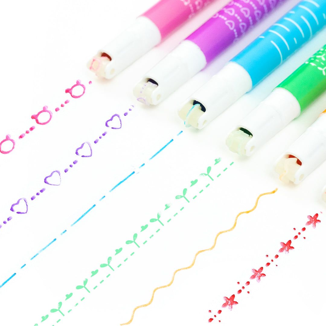 Set of colorful markers with sample lines on a white background