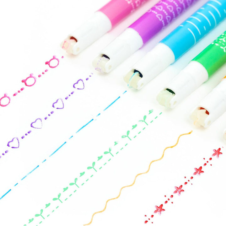 Set of colorful markers with sample lines on a white background