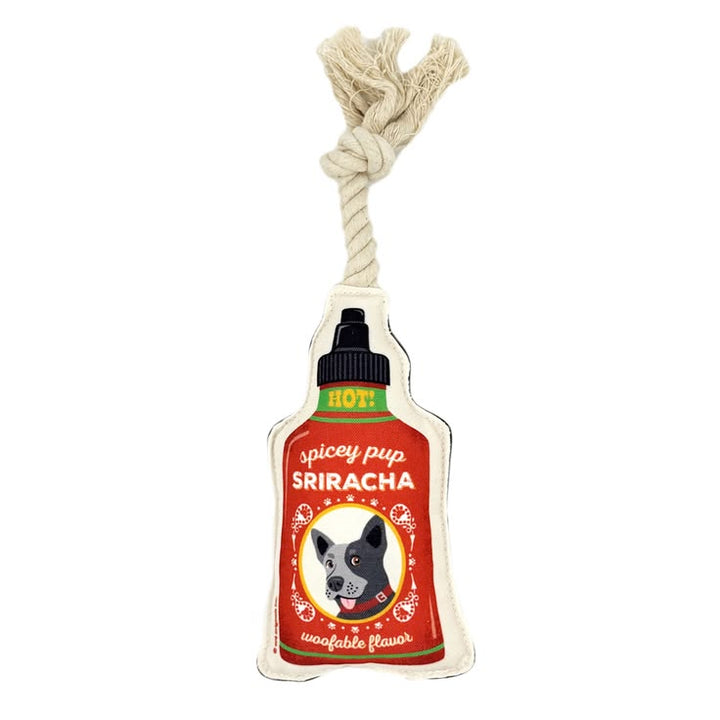 Dog toy designed like a Sriracha bottle with a rope handle on a white background