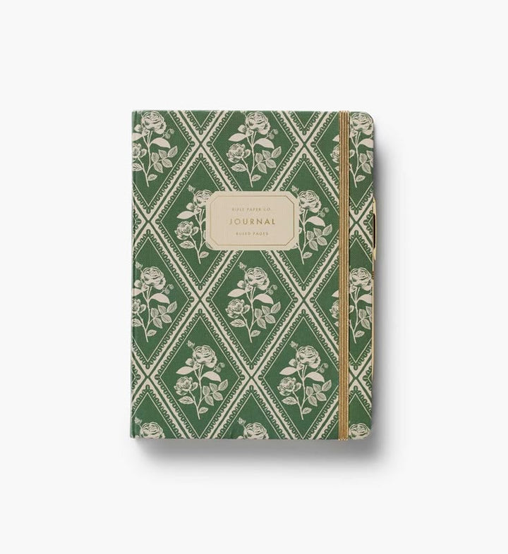 Journal with green floral pattern on a white background