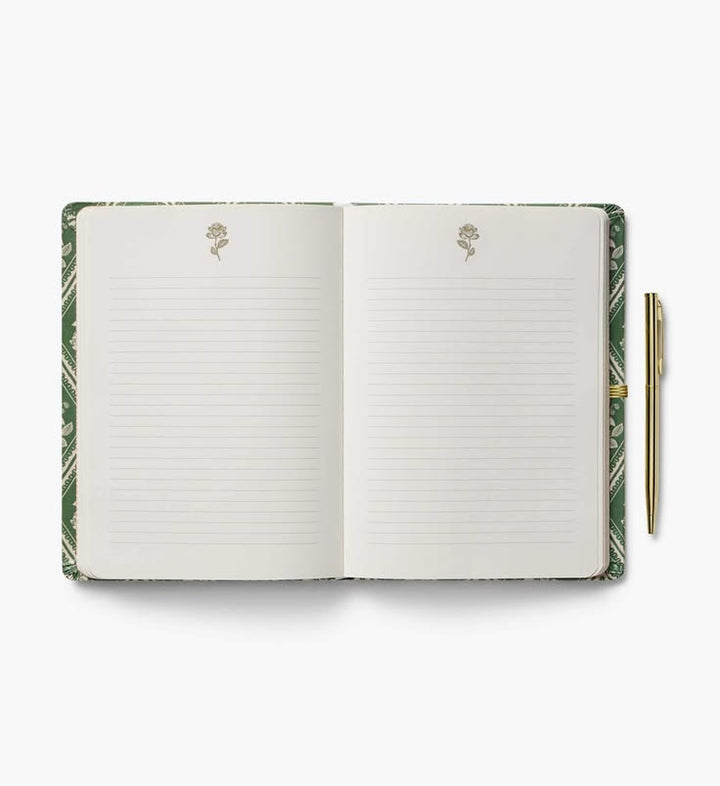 An open lined notebook with a green patterned cover and a gold pen placed to the right, photographed on a clean white background.
