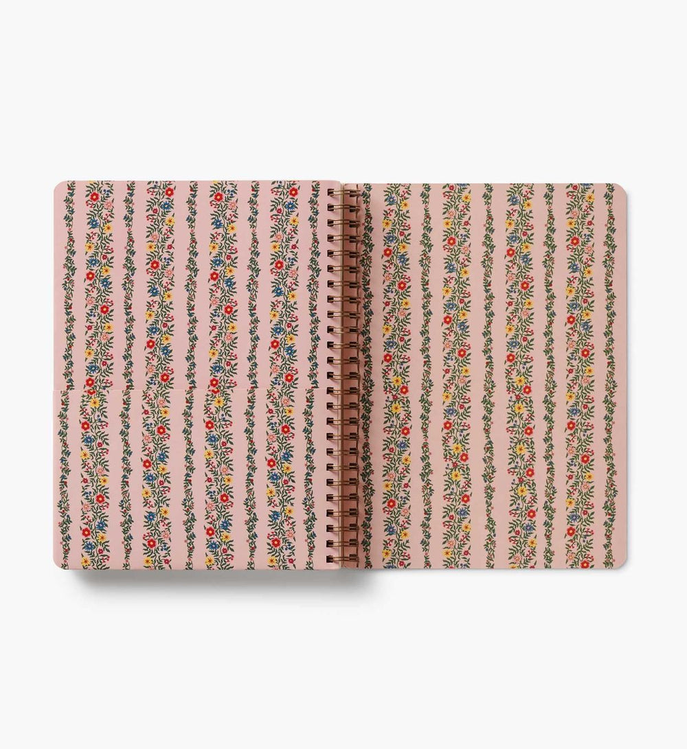 Notebook with floral striped design on a white background