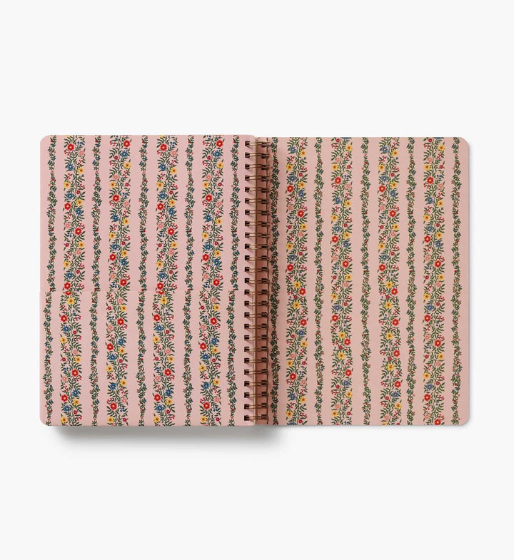 Notebook with floral striped design on a white background