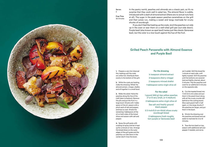 A printed recipe book or cookbook spread showing a prepared dish on the left page and recipe text on the right page, photographed against a dark teal background.