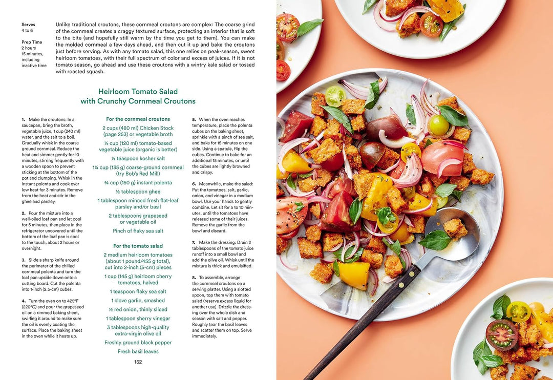 A printed recipe page showing the preparation instructions for Heirloom Tomato Salad with Crunchy Commemorative Crouions, alongside a large appetizing food photograph of the prepared salad on a peach background.