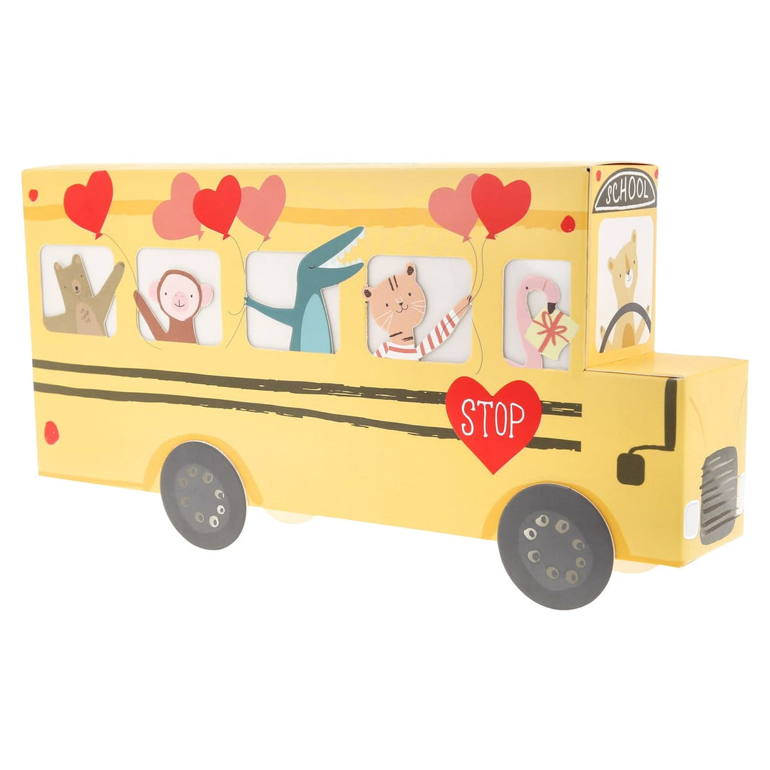 Yellow toy school bus with cartoon characters and hearts on a white background