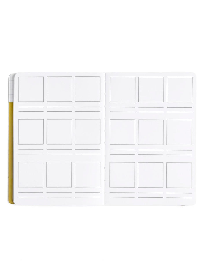 A white double-page card stock binder insert with multiple rectangular photo slots, shown open against a plain white background.