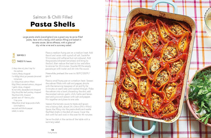 Pasta shells with salmon and chili in a baking dish on a checkered tablecloth