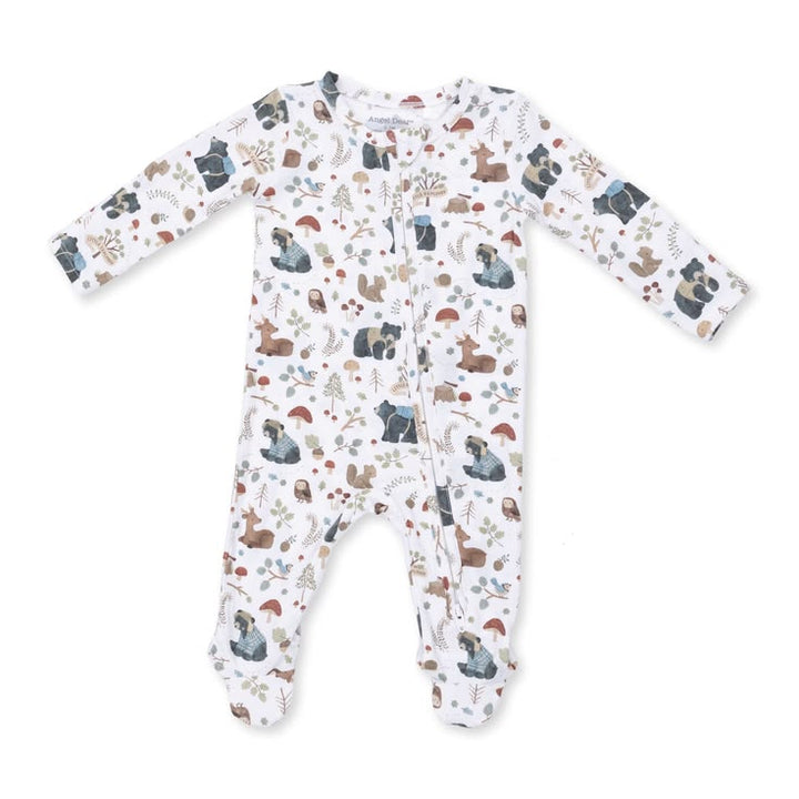A baby long-sleeve footed sleeper with an all-over woodland animal print on a white background. The print features bears, deer, squirrels, and trees in muted earthy tones.