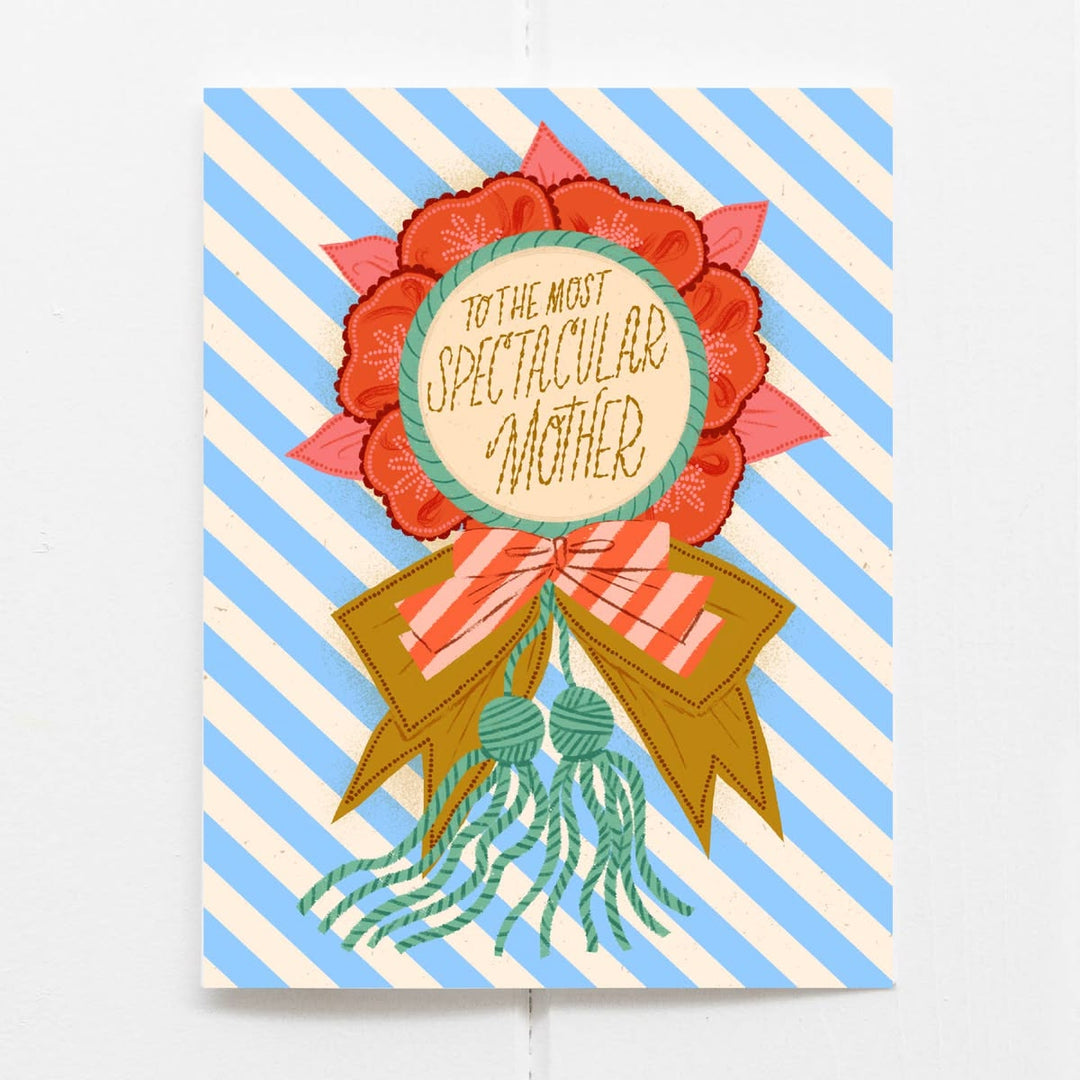 Greeting card with decorative ribbon and floral design on a striped background