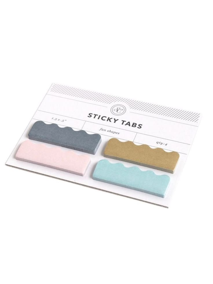 Four scalloped-edge sticky tabs in pastel gray, pink, gold, and light blue, attached to a white backing card labeled 'STICKY TABS' on a white background.