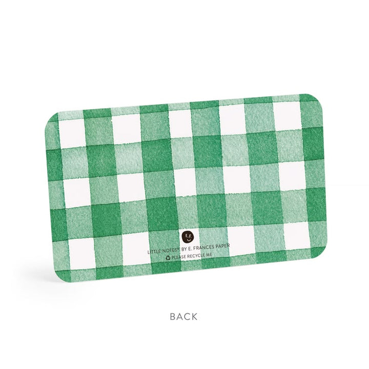 Green and white checkered card with brand name on a white background