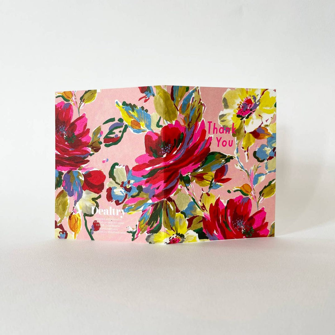 Floral card with 'Thank You' text on a pink background
