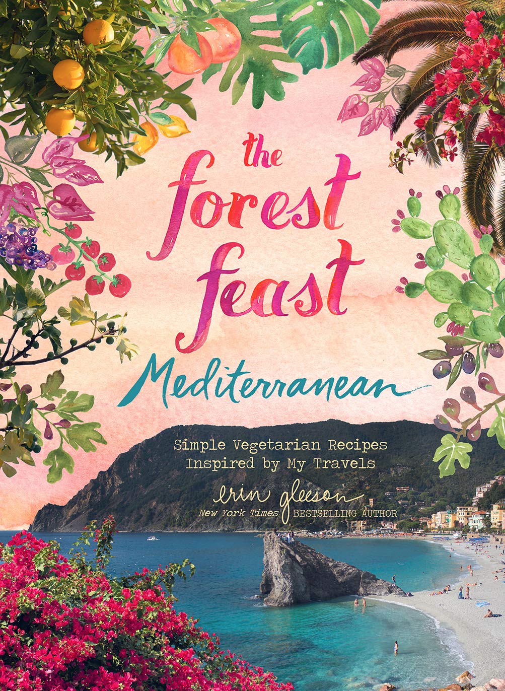 Book cover of 'The Forest Feast Mediterranean' with a scenic view and floral design.