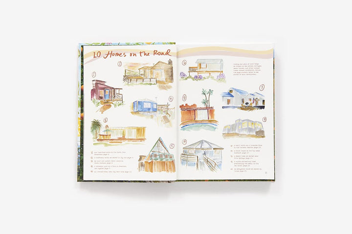 An open illustrated book or magazine spread titled "10 Homes on the Beach," showing watercolor drawings of beach house designs on both pages, photographed against a plain white background.
