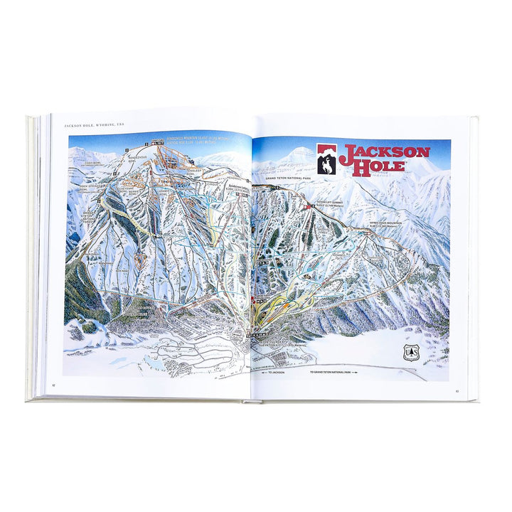 Open book showing a map of Jackson Hole with mountain scenery