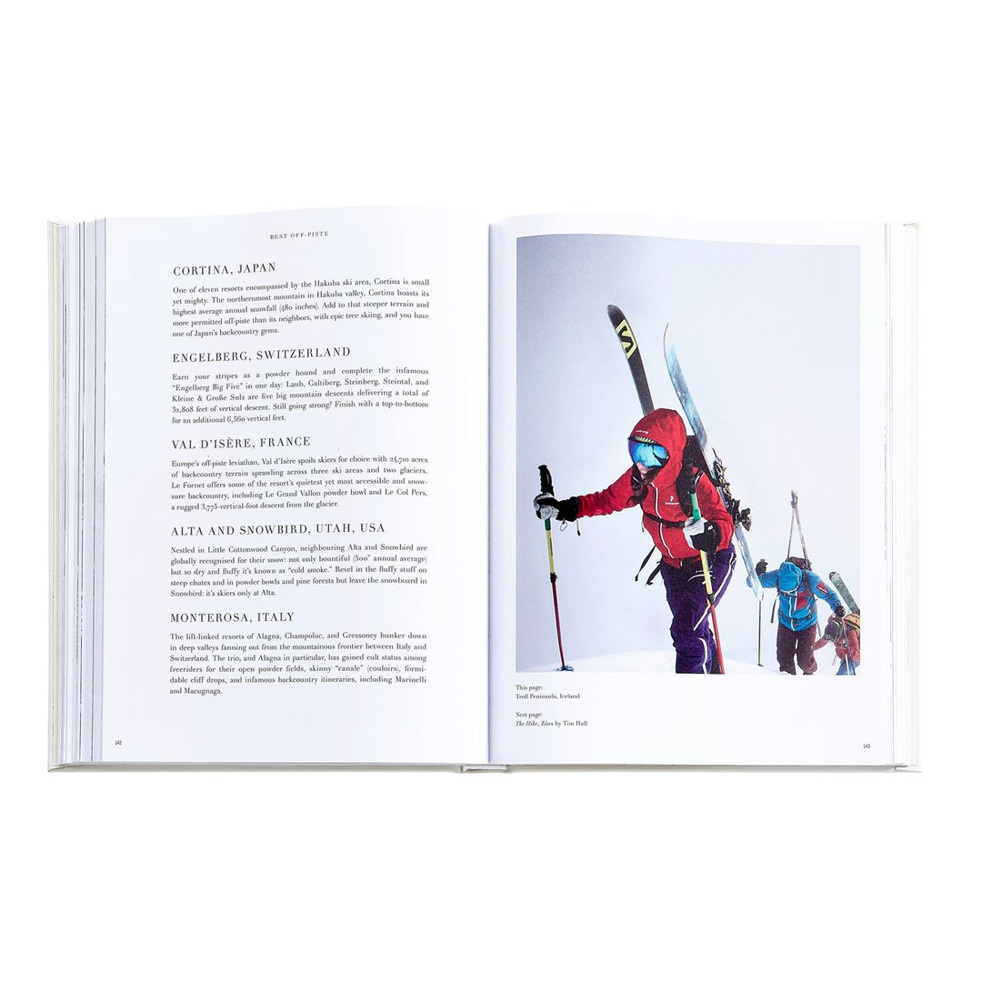 Open book showing skiers with ski equipment on a white background