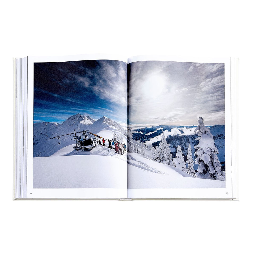 Open book showing a snowy mountain landscape with a helicopter and people.