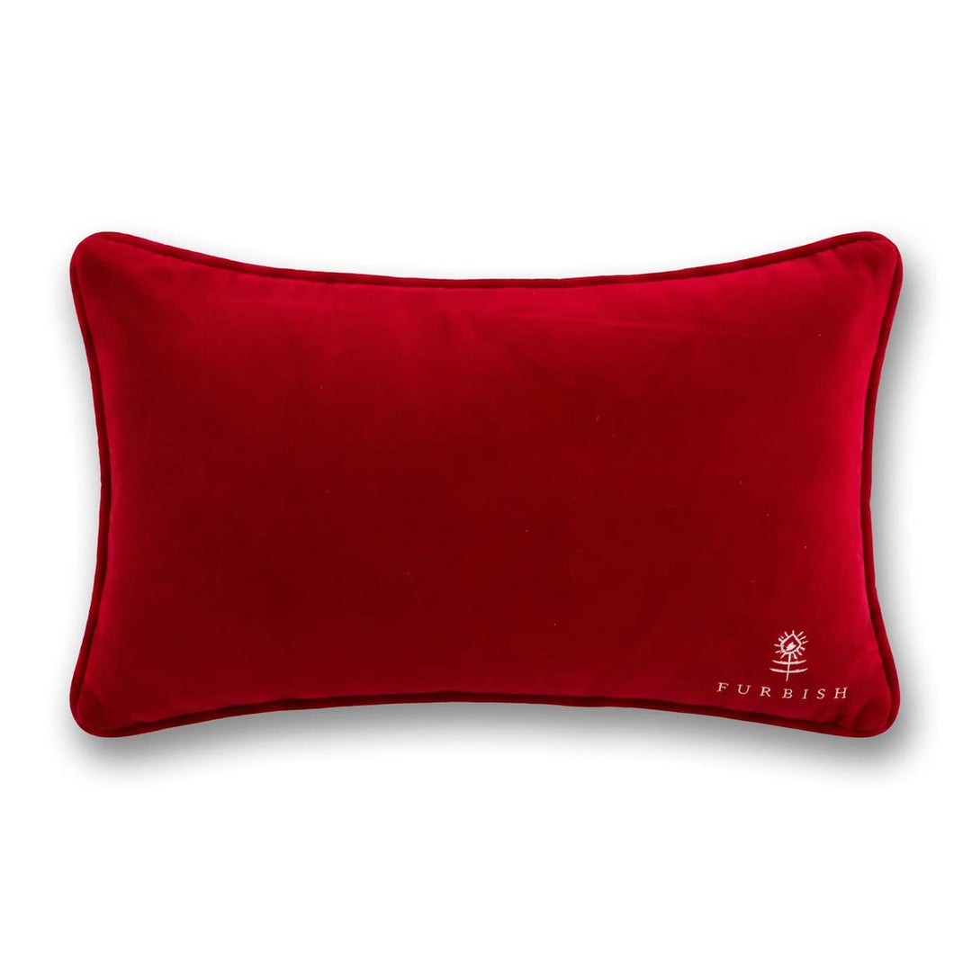 A rectangular red velvet lumbar pillow with piped edges and a small white embroidered FURBISH logo in the bottom right corner, shown on a clean white background.