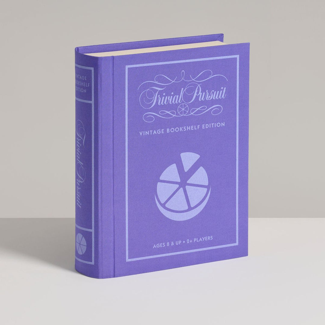 Purple 'Trivial Pursuit' game box on a gray background