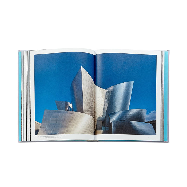 Open book showing a photograph of a modern architectural structure against a blue sky.