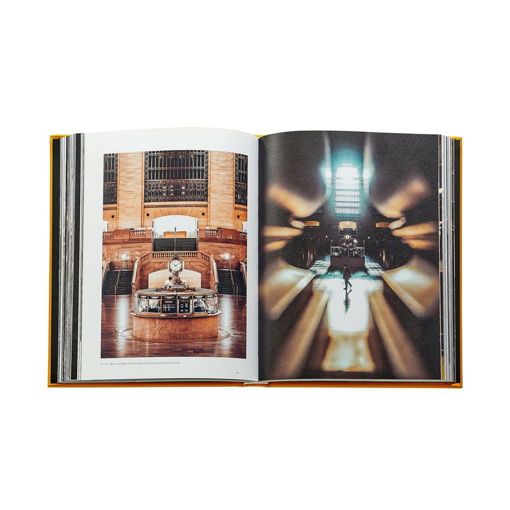 Open book showing two interior views of a grand hall with wooden architecture.