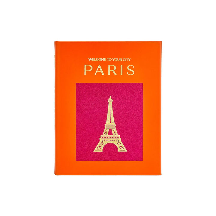 Book with orange cover and Eiffel Tower illustration on a white background